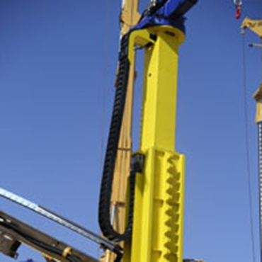 e-chain® installed hanging in a construction machine